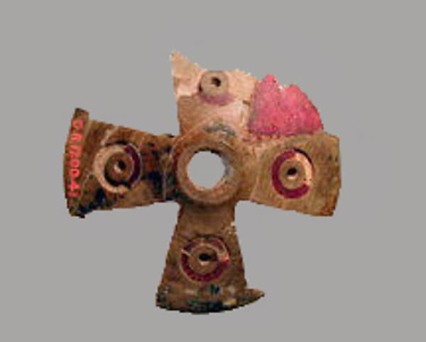 Ivory and amber ornament on bronze surface