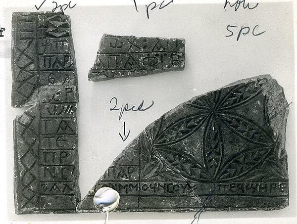 Fragments of an Inscribed Slab with a Rosette