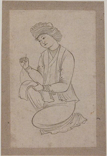 Young Man Sewing