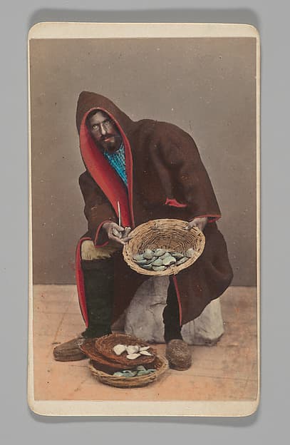 [Studio Portrait: Man Holding Basket of Oysters?, Venice], by Unknown