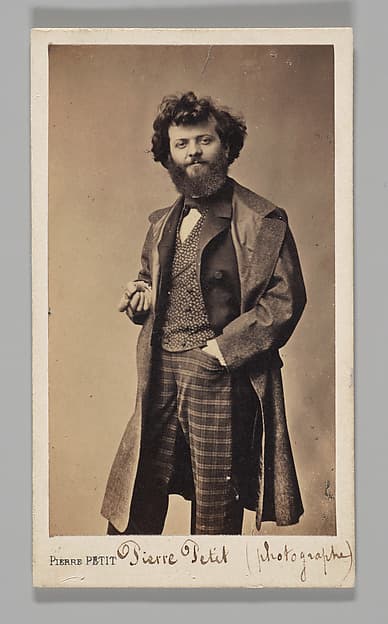 [Studio Portrait: Self-Portrait Wearing Plaid Pants and Overcoat], by Pierre Petit