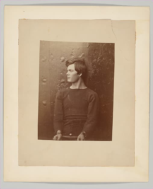 [Lewis Payne (Lewis Powell), Lincoln Assassination Conspirator, in Sweater, Seated and Manacled on the USS Saugus, Washington Navy Yard], by Alexander Gardner