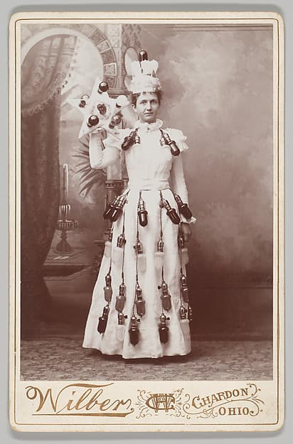 [Merchants' Carnival Portrait: Electric Light Bulb Purveyor, Chardon, Ohio], by Henry Carlton Wilber