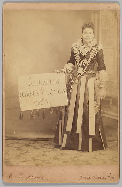 [Merchants' Carnival Portrait: John Arpin Lumber and Logs, Grand Rapids, Wisconson], by E. L. Kromer