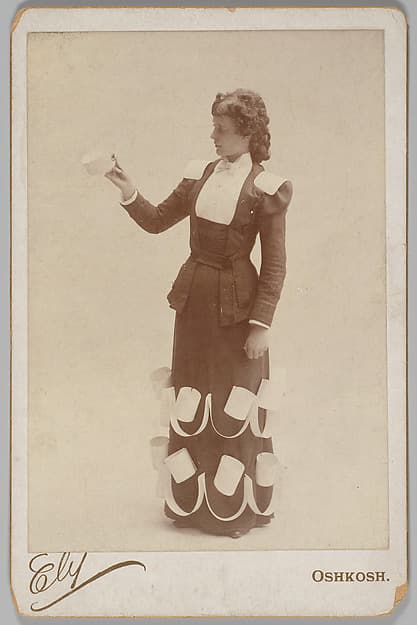 [Merchants' Carnival Portrait: Collar and Cuff Maker, Oshkosh, Wisconsin], by Cook Ely