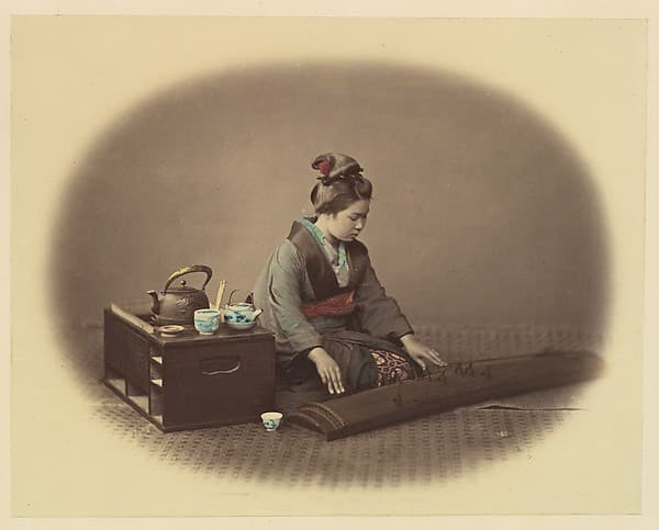 [Woman with Tea Set Playing the Koto], by Felice Beato