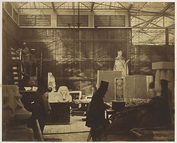 [Storeroom with Artisans and Plaster Casts, Crystal Palace], by Philip Henry Delamotte