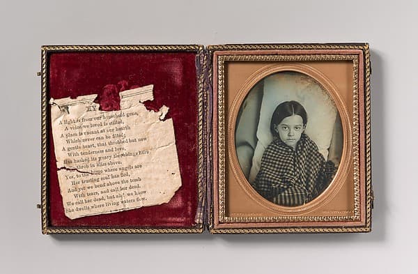 [Young Girl Wearing Gingham Shawl, Resting on Pillow], by Beckers & Piard