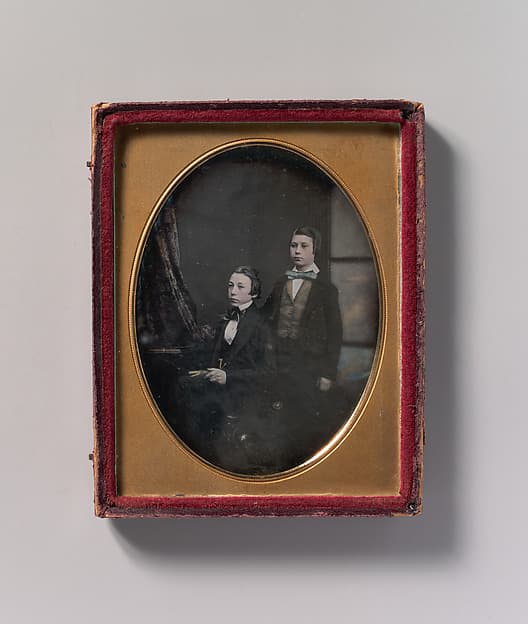 [Two Young Men in Bow Ties, One Seated Holding a Book, One Standing], by Robert Boning