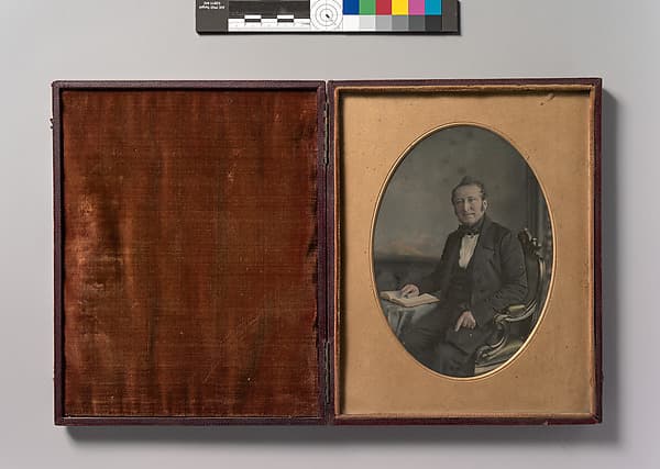 [Seated Man Pointing to a Passage in an Open Book], by John Jabez Edwin Mayall