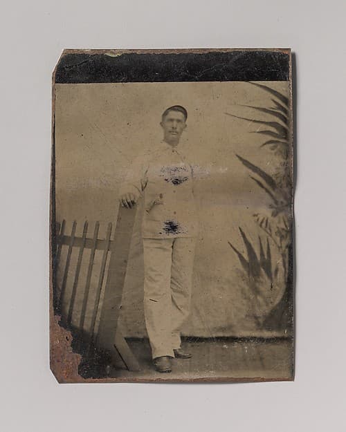 [Painter Resting His Hand on Picket Fence], by Unknown