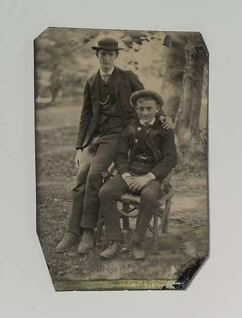 [Two Young Men Outdoors, One Seated, the Other on the Arm of the Chair], by Unknown