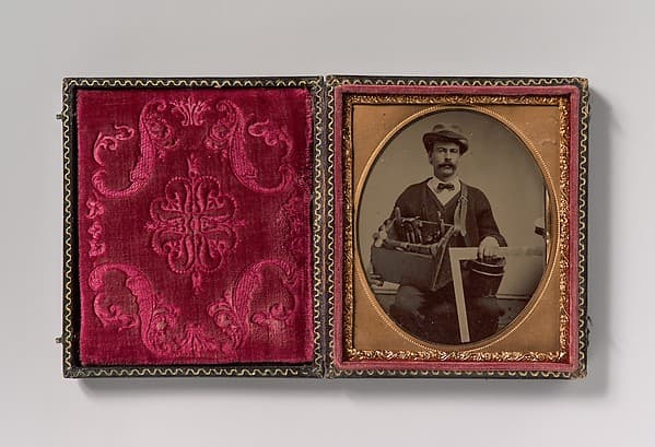 [Carpenter Holding a Bag of Tools and a Square], by Unknown