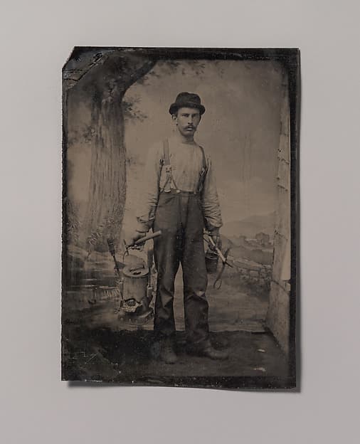 [Tinsmith in Front of Painted Outdoor Backdrop], by Unknown