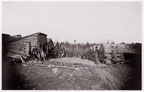 [Winter Quarters of Unidentified Union Army Regiment with Two Rows of Log Cabins], by Unknown