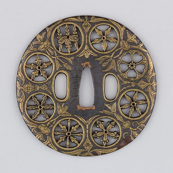 Sword guard (Tsuba) Depicting Crests and Arabesques (家紋散唐草文鐔), by Koike Izumi no Kami Naomasa