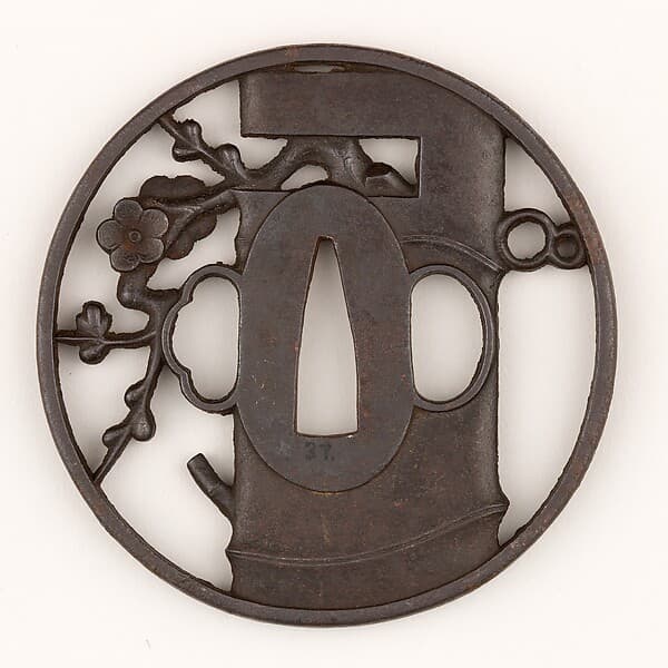 Sword Guard (Tsuba) Depicting Bamboo Vase for Ikebana and Plum Branch