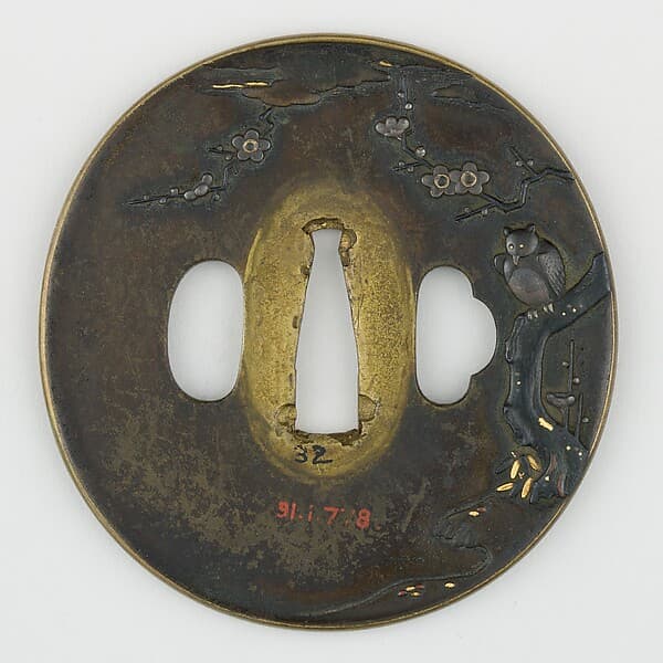 Sword Guard (Tsuba) Depicting Horned Owl in Plum Tree (梅樹に木菟図鐔)
