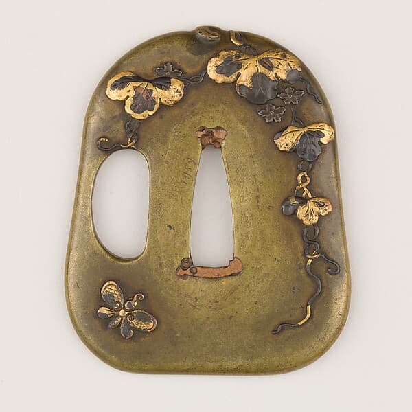 Sword guard (Tsuba) With the Motif of Paulownia Leaves, Tendrils, and Butterfly (蝶に桐唐草図鐔)