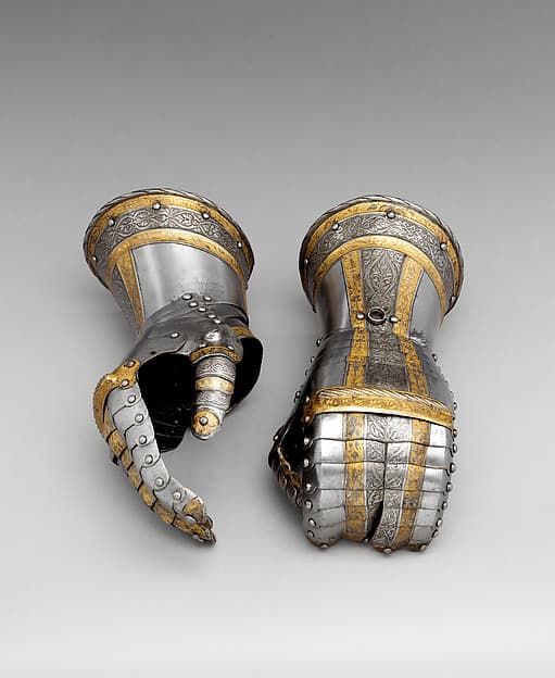 Pair of Gauntlets from a Garniture of Armor of Philip II of Spain (reigned 1556–98), by Desiderius Helmschmid