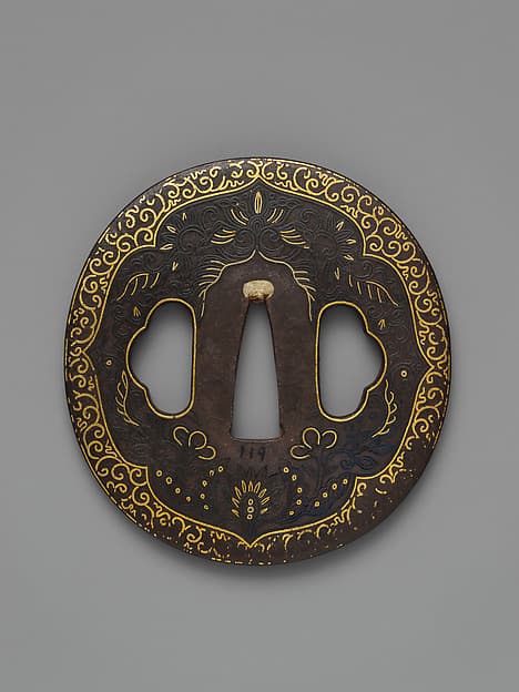 Sword Guard (Tsuba) Depicting Biting Lion Heads (Shikami) and Arabesques (獅噛唐草図南蛮鐔)