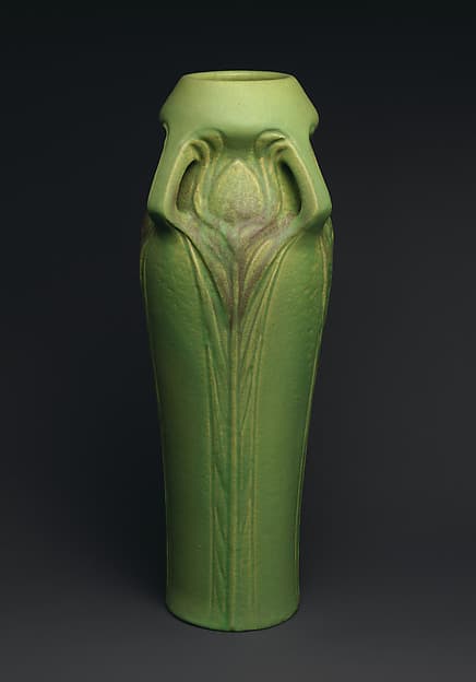 Vase with peacock feathers, by Artus Van Briggle