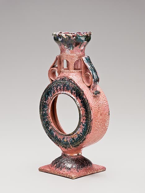Clock case and vase, by George E. Ohr