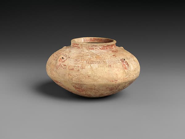 Squat jar with pierced lug handles