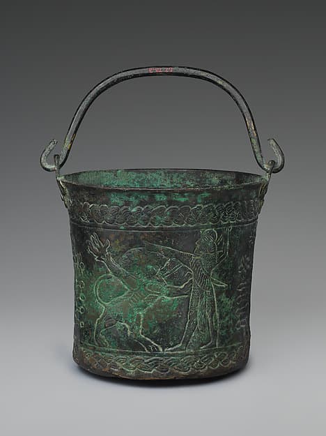 Bucket with forgery decoration
