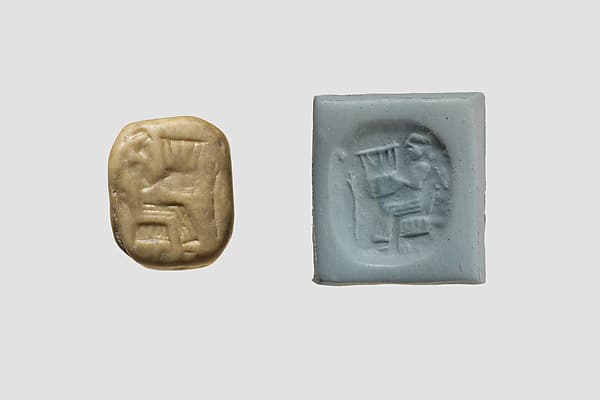 Stamp seal (octagonal pyramid, worn) with musician