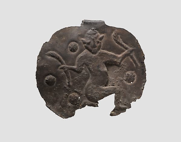 Pendant with a kneeling male