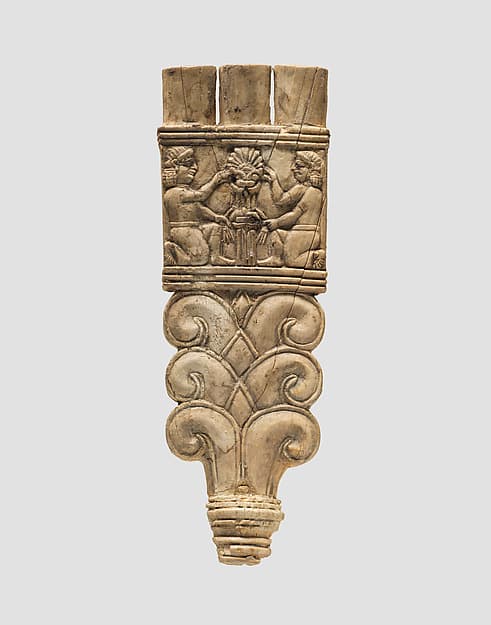 Handle of a flywhisk or fan