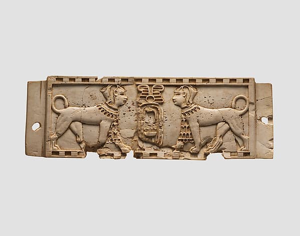 Cloisonné furniture plaque with two sphinxes flanking a cartouche