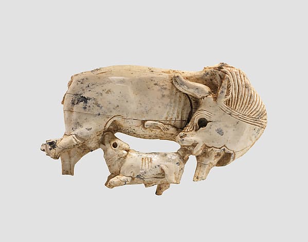 Openwork furniture plaque with a cow suckling a calf