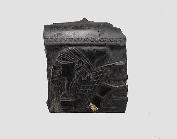 Cosmetic box fragment carved in relief with the head of a sphinx