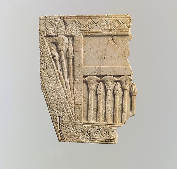 Furniture plaque carved in relief with papyrus buds and flowers