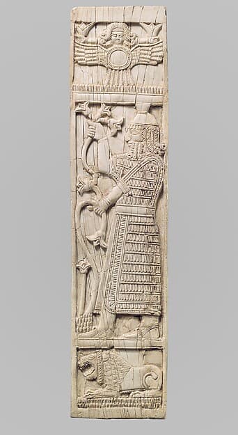 Furniture plaque carved in relief with warrior holding lotuses
