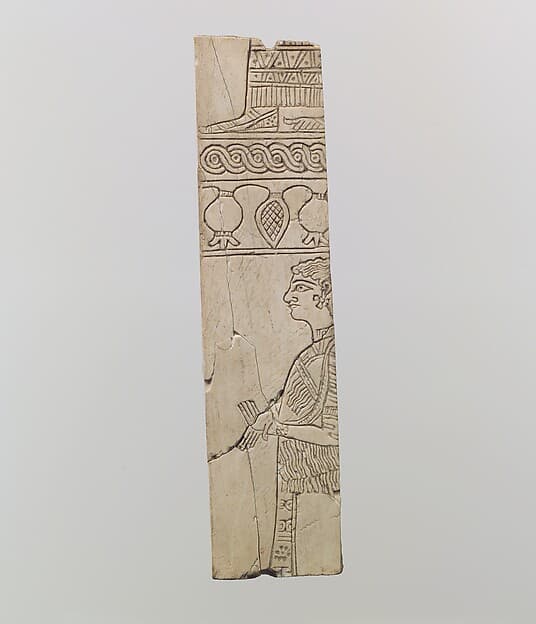 Incised furniture plaque with two figures in two registers
