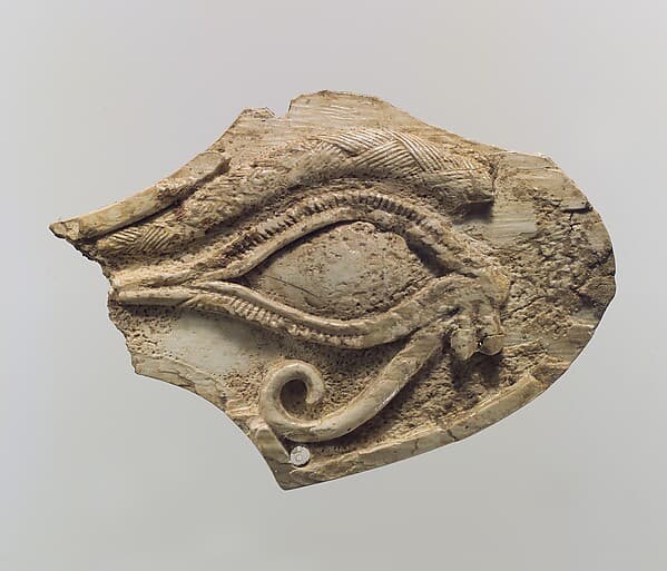 Horse blinker carved in relief with a wedjat eye