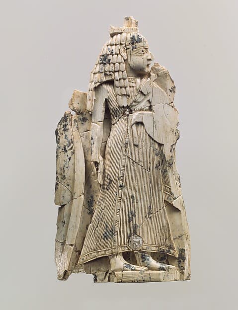 Furniture plaque carved in relief with a female figure