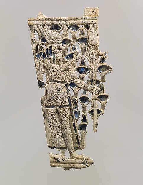 Openwork furniture plaque with a falcon-headed figure in a papyrus thicket