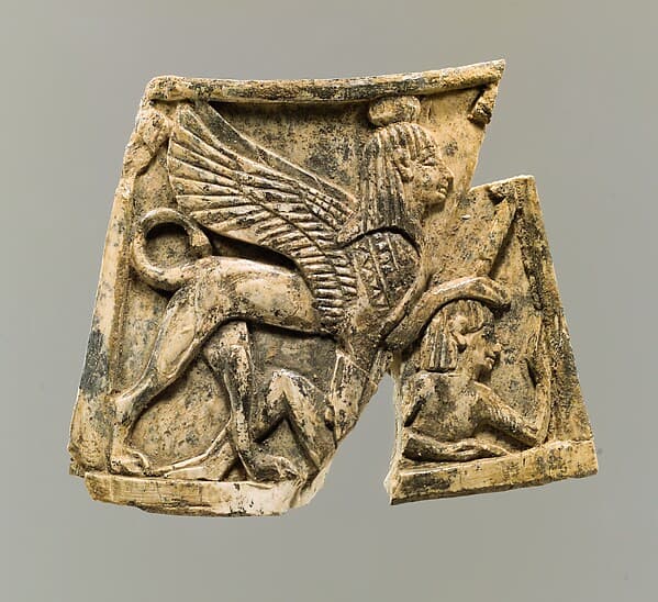 Plaque carved in relief with sphinx trampling figure