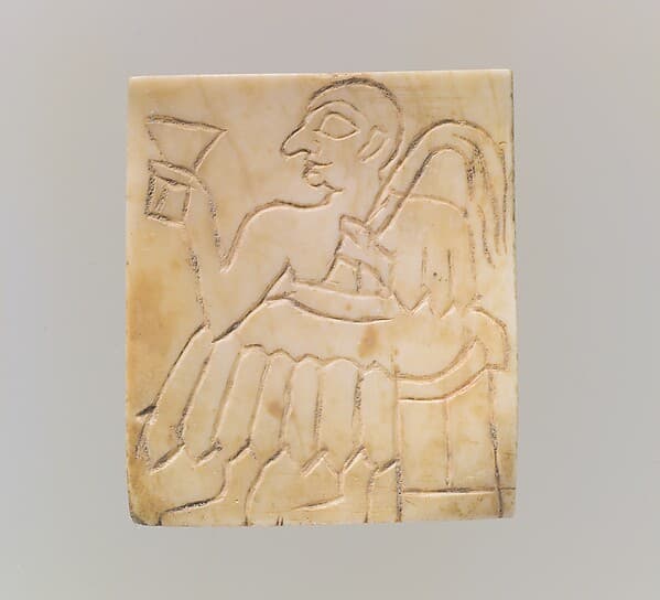 Inlay: seated male with cup and palm frond