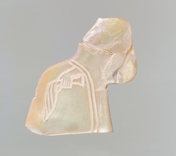 Inlay: banquet scene with a seated figure holding a palm frond