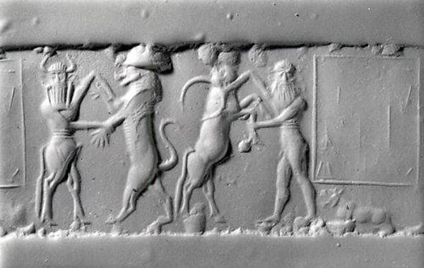 Cylinder seal and modern impression: heroes wrestling rampant animals