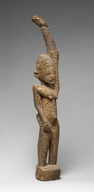 Female figure with raised arm, by Tellem blacksmith
