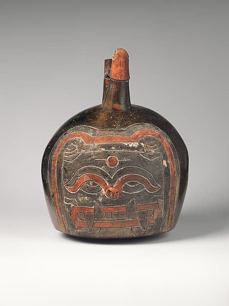 Spout-and-bridge bottle with feline face, by Paracas artist(s)