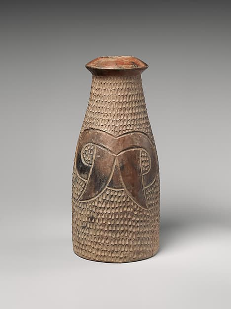 Bottle with fang motif, by Cupisnique artist(s)