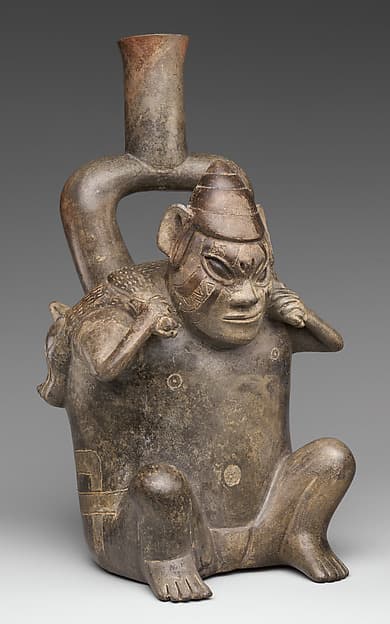 Stirrup-spout bottle with figure carrying deer, by Cupisnique artist(s)