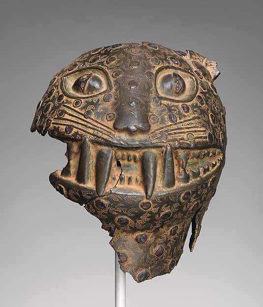Fragment of a leopard head, by Ìgùn Ẹ́rọ̀nwwọ̀n (brass-casting guild) artists